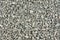 Gray small rocks ground texture. black small road stone background. gravel pebbles stone seamless texture, marble. dark background