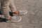 Gray Sneakers shoes walking on concrete top view , Canvas shoes walking on concrete