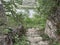 Gray steps from the cliff. Old gray stones. Green grass. Tsypovo-Moldova