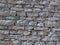 Gray stone wall. Background. Light and shadows. Shadow stones. Vertical horizontal diagonal. Textura. Black white. Portugal