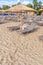 Gray straw umbrella on beautiful beach background