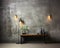 Gray studio background with simple furniture and burning electric lamps