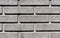 Gray stylized brick wall texture.