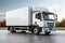 Gray surface hosts white delivery truck, seamless logistics in motion