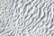 Gray texture of Pamukkale calcium travertine, pattern of diagonal waves