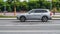 Gray Volvo XC90 car moving on the street. Compliance with speed limits on road concept. Dynamic exterior image