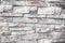 Gray wall background of uneven brickwork stone texture