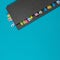 Gray weekly planner with bookmarks on a blue background. Business planning and personal promotion concept. Flat lay. Copy space