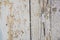 Gray and white background of weathered painted wooden plank