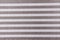 Gray and white horizontal stripe background. close-up