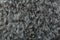 Gray wool texture background, cotton wool, grey fleece, dark fluffy fur, curly hair