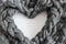 Gray woolen braid in a heart shape