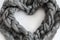 Gray woolen braid in a heart shape