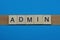 Gray word admin in small square wooden letters