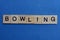 Gray word bowling from small wooden letters