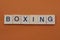 Gray word boxing from small wooden letters