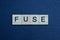 Gray word fuse from small wooden letters