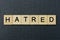 Gray word hatred from small wooden letters