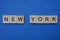 Gray word new york from small wooden letters