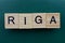 Gray word riga from small wooden letters