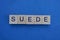 Gray word suede from small wooden letters