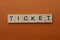 Gray word ticket from small wooden letters