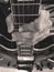 Grayscale closeup of a man\'s hand holding an electric guitar