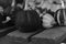 Grayscale closeup of pumpkins on a wooden surface