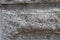 Grayscale detailed view of a stone wall creates a grainy background
