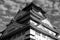 Grayscale low angle shot of Osaka Castle in Japan under cloudy sky