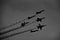 Grayscale low angle shot of Patriots Jet Team during Fleet Week