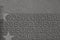 Grayscale macro shot of small writing on a 50 euro banknote