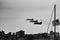 Grayscale shot of fighter jets in the sky with the American flag on the side