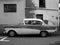 Grayscale shot of a four-door German sedan of the economic miracle era with a panoramic window