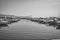 Grayscale shot of a harbor with different kinds of boats in Manfredonia, Foggia, Italy