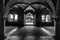 Grayscale shot inside of abbey of saint galgano in tuscany italy with arch walls design