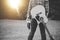 Grayscale shot of a lonely male with a guitar holding the Christian hymn book