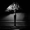 Grayscale shot of a luxurious glass lamp