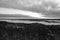 Grayscale shot of Tolkuse Raba landscape under a cloudy sky in Estonia