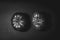 Grayscale shot of two ripe Spanish tomatoes on a solid tabletop, isolated on a blank background