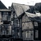 Grayscale square shot of residential buildings in the city on Dinan, Bretagne, France