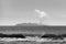 Grayscale view of the sea waves before the Whakaari Island