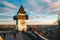 Graz city landmark Schlossberg park tower at sunset and city pan