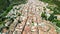 Grazalema, Andalusia. Aerial view of whitewashed houses sporting rust-tiled roofs and wrought-iron window bars