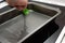 Greasing baking sheet with oil