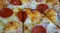 Greasy pepperoni pizza texture background