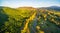 Great Alpine Road passing through Australian countryside at suns