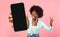 Great App. Black Woman Holding Smartphone With Blank Screen And Gesturing Peace