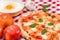 Great background for culinary themes, handmade pizza with daisy flavor on checkered Italian style towel background with different