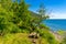 Great Baikal Trail. Route along lake Baikal shore from Listvyanka to Big Koty. Place to relax, wooden table with bench near lake